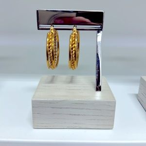 Gold hoop earrings, by @__strand__